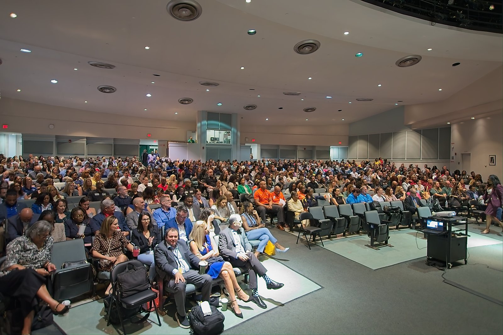 Wide view of the full auditorium seated for an Academic Leadership Days general session