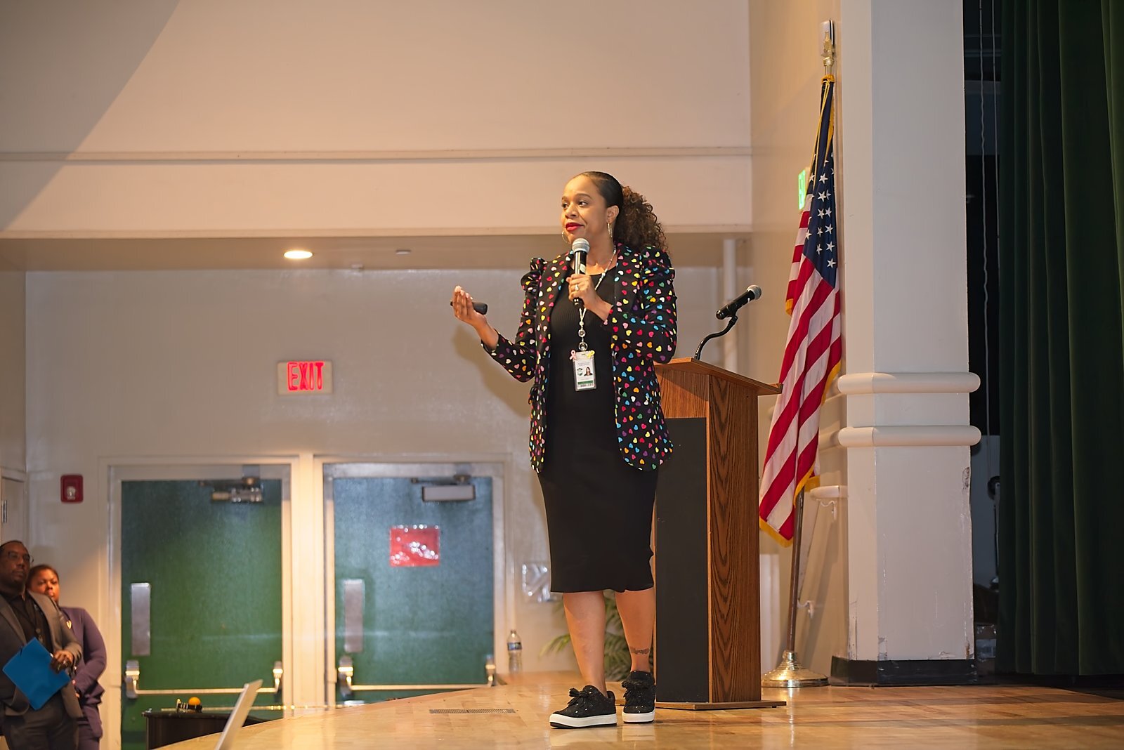 A presenter speaking from the stage during Academic Leadership Days