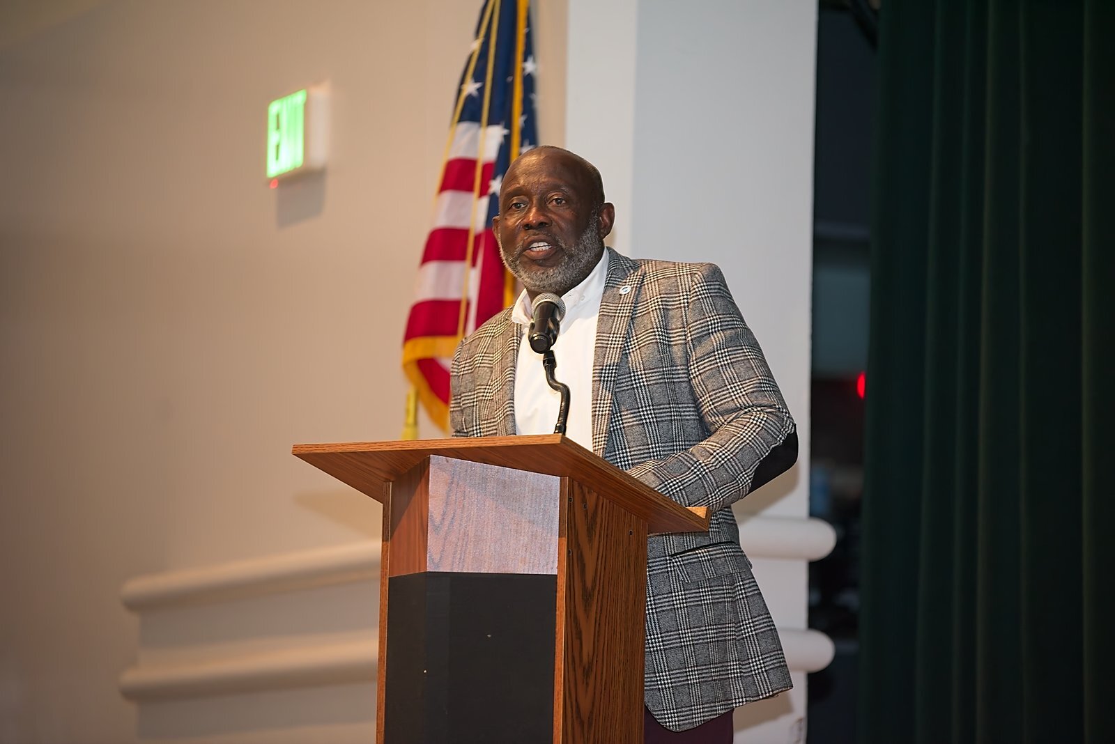 A presenter speaking at the podium during Academic Leadership Days
