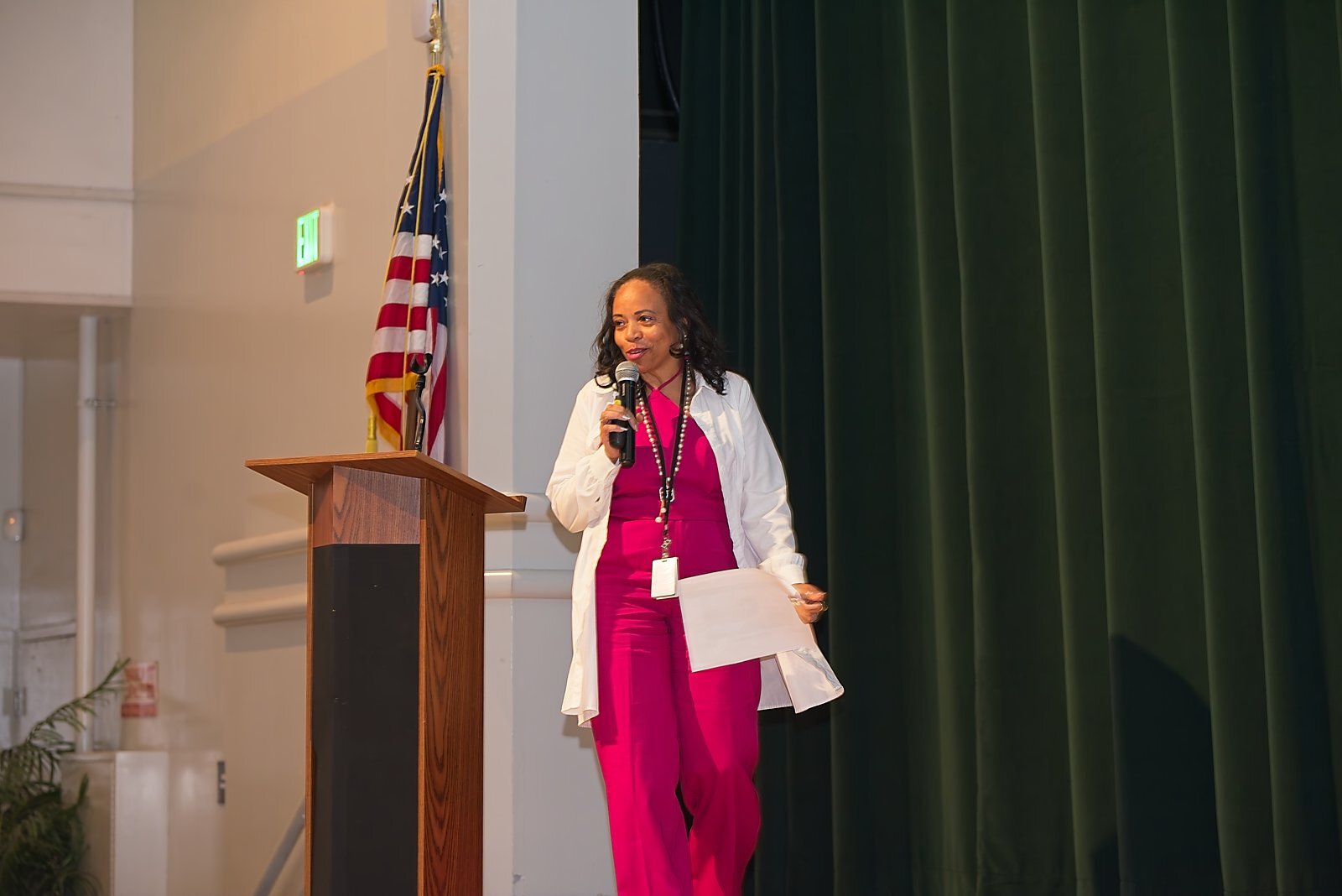 A presenter speaking from the stage during Academic Leadership Days