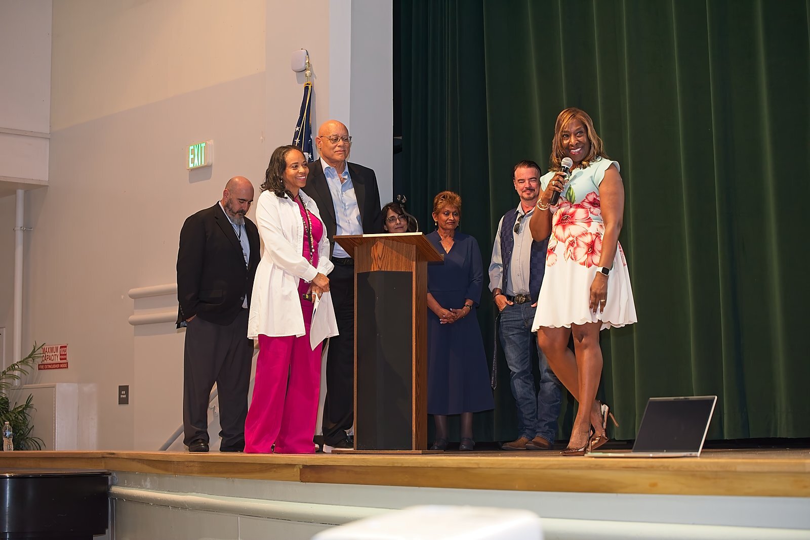 District and school leaders gathered together on stage