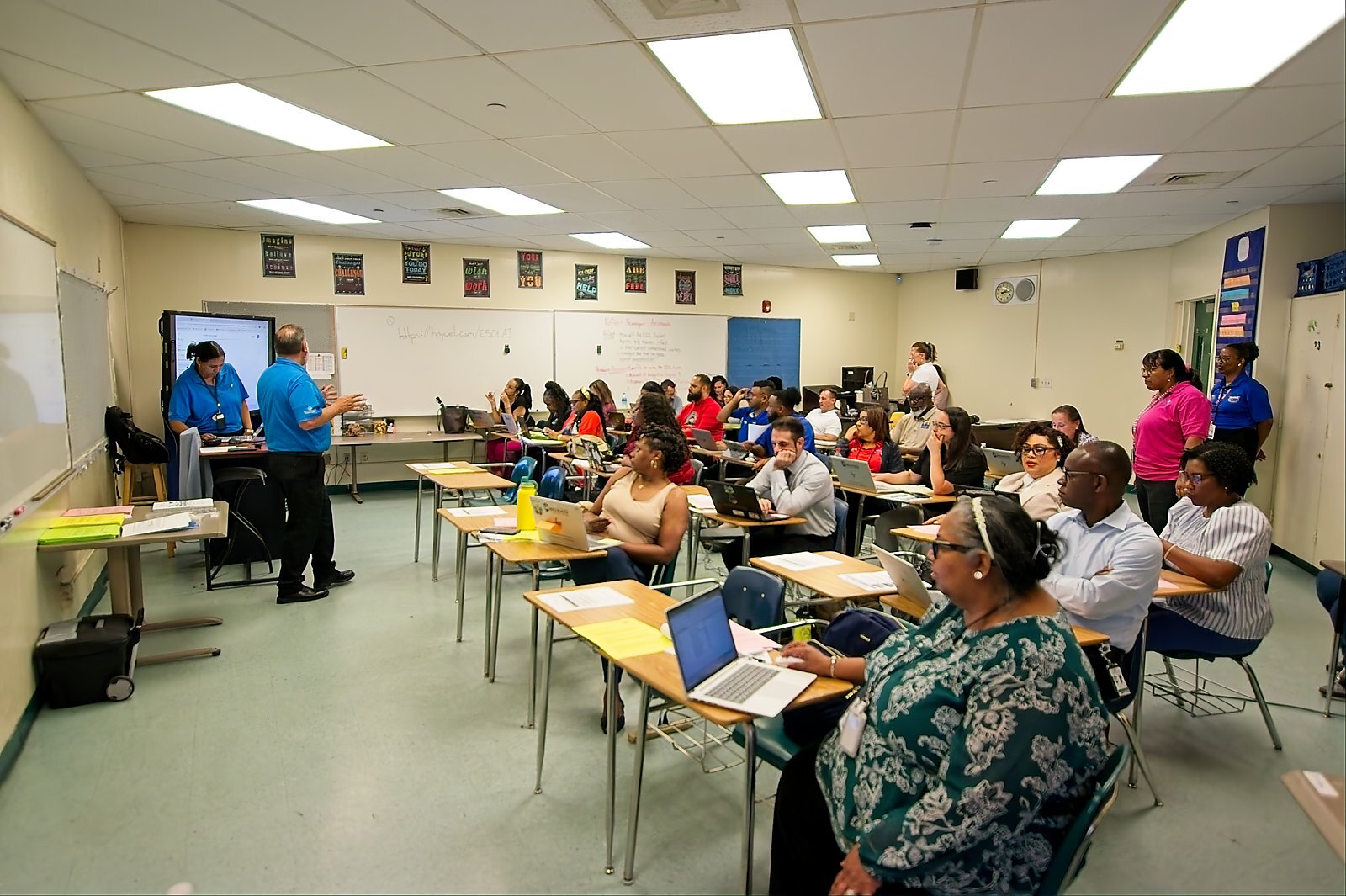 An ESOL and AI breakout session, attendees at laptops