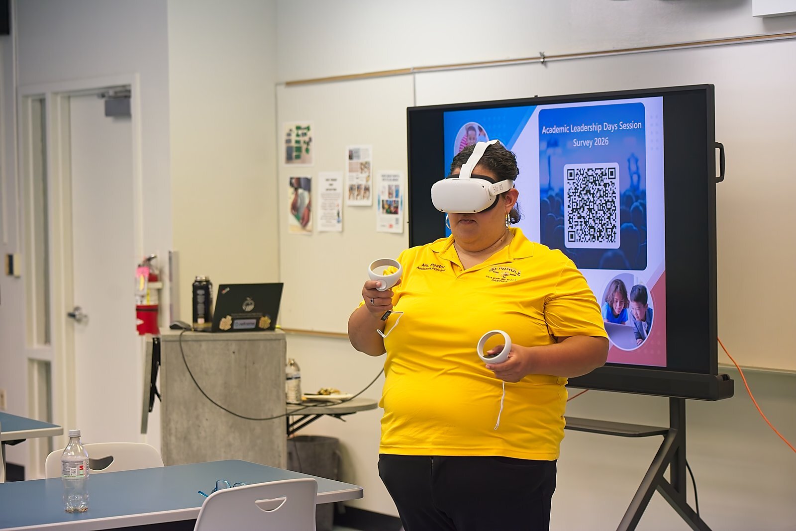 An administrator trying a virtual reality headset during a breakout session