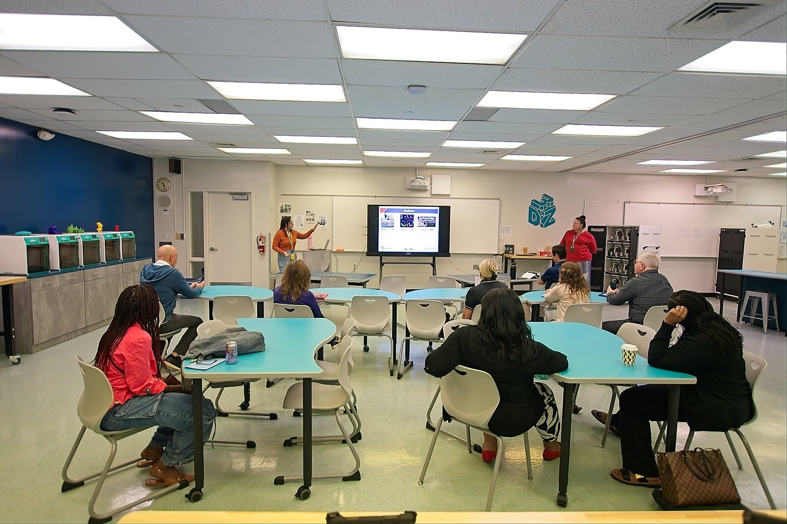 A breakout session in a makerspace classroom with 3D printers