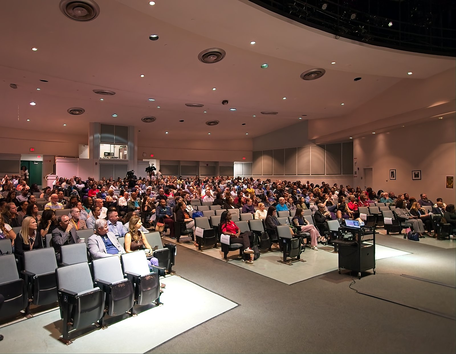 Audience members listening during the Parent AI Symposium