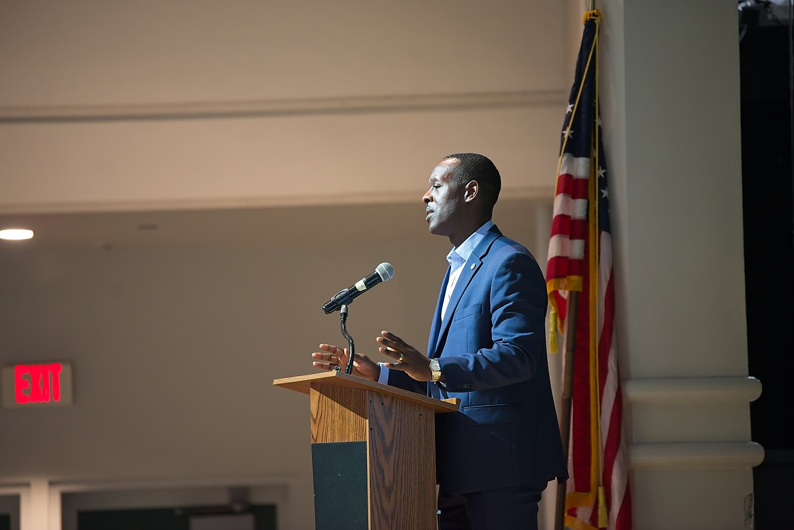District leader speaking at the Parent AI Symposium podium