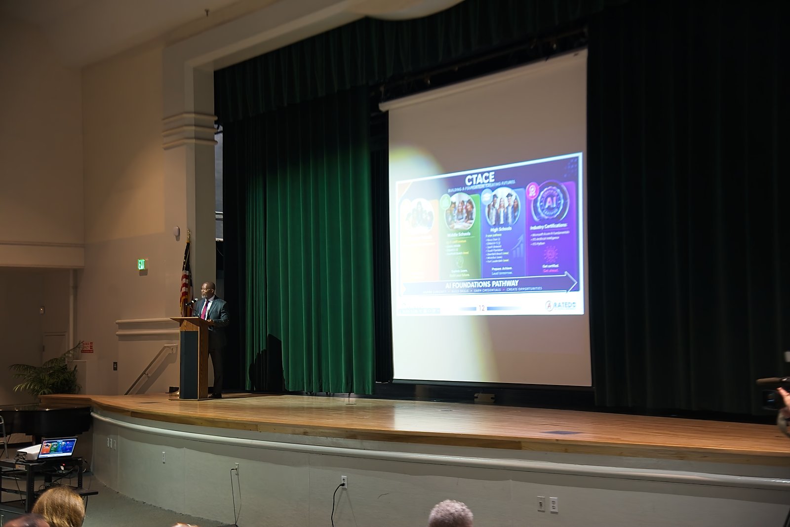 Panel discussion on stage at the Broward Powered by AI symposium